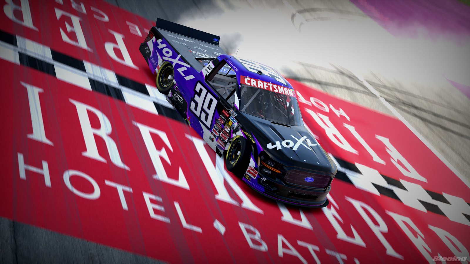 Purple and black 40XLI #39 Ford truck doing a burnout