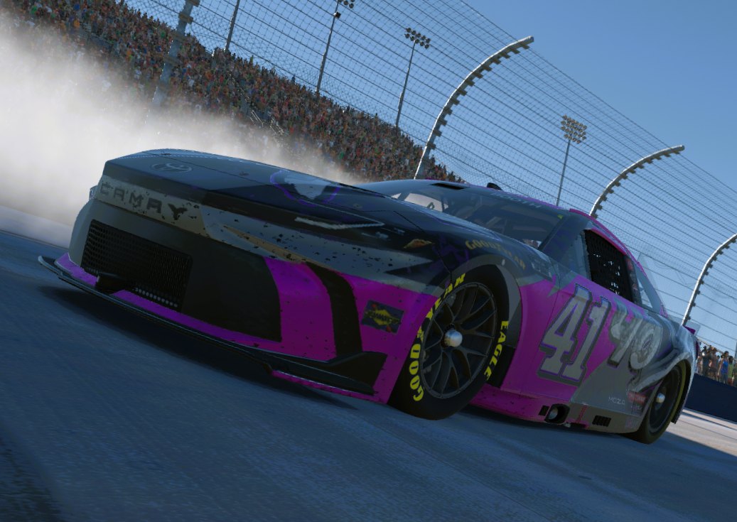 Pink and black 40XLI #41 Toyota Camry doing a burnout